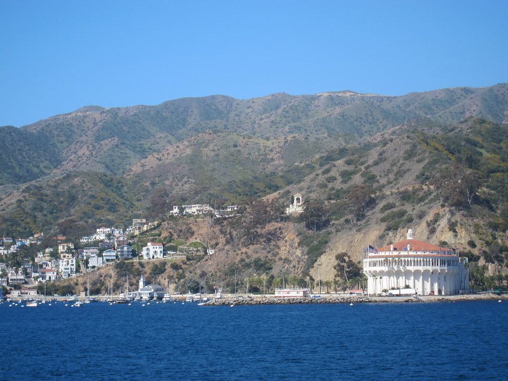 The Avalon Casino and hillside homes seen from a boat out in the channel on a clear day